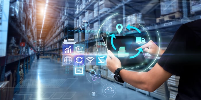 Artist's rendering of a person touching digital icons in the air to accomplish warehouse tasks. 